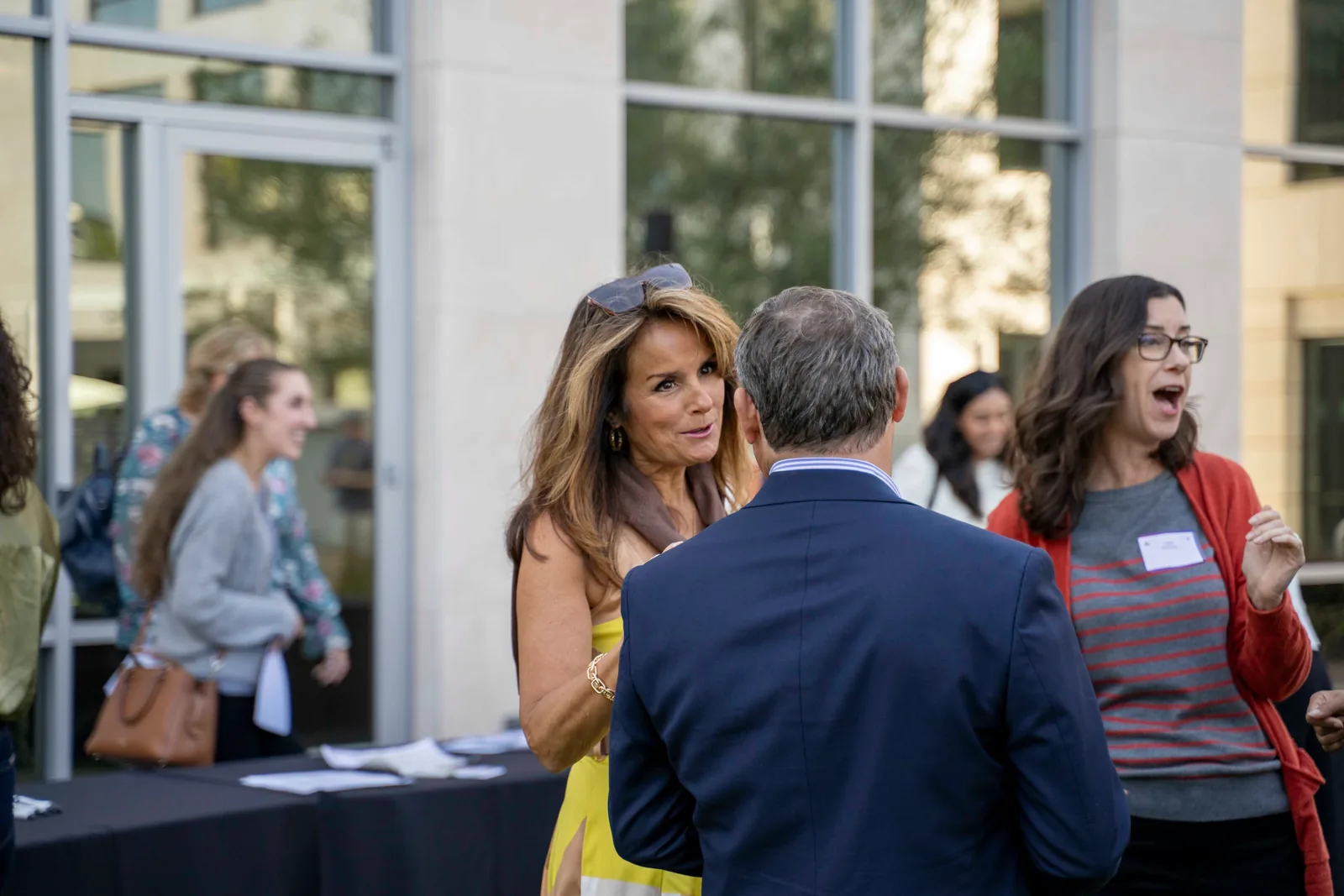 Guests networking outside the BioMed Realty building at the 2025 Summer Wine Social